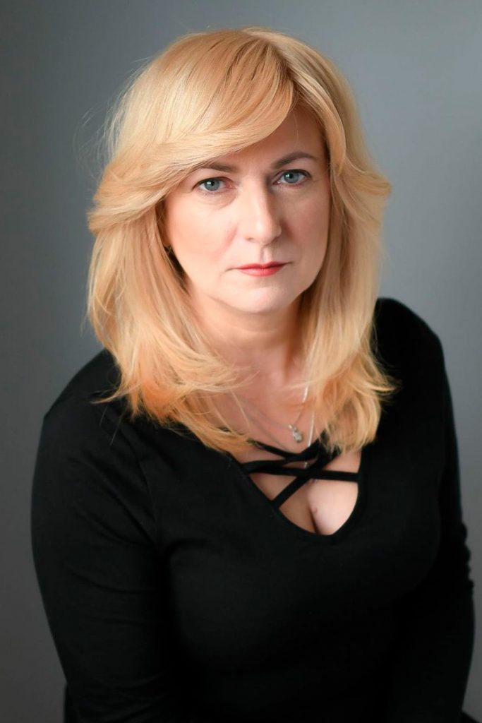 Blonde Layered Haircut with Curtain Bangs