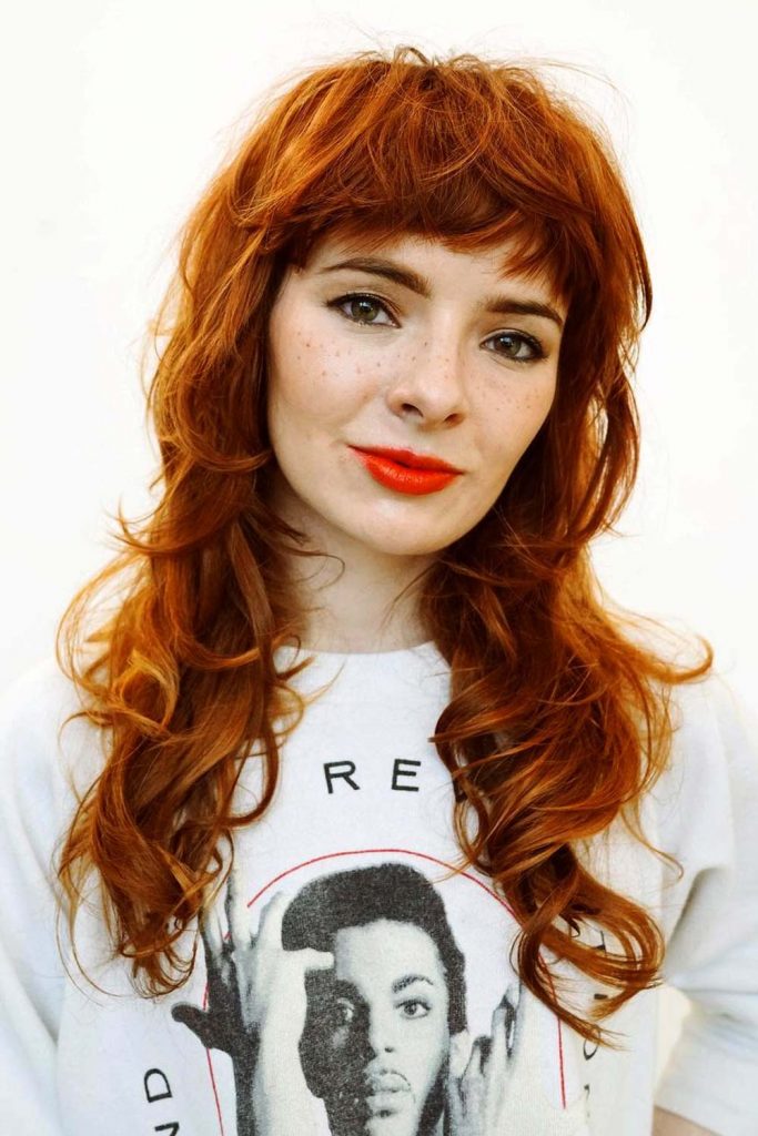 Ginger Butterfly Haircut with Thick Bangs