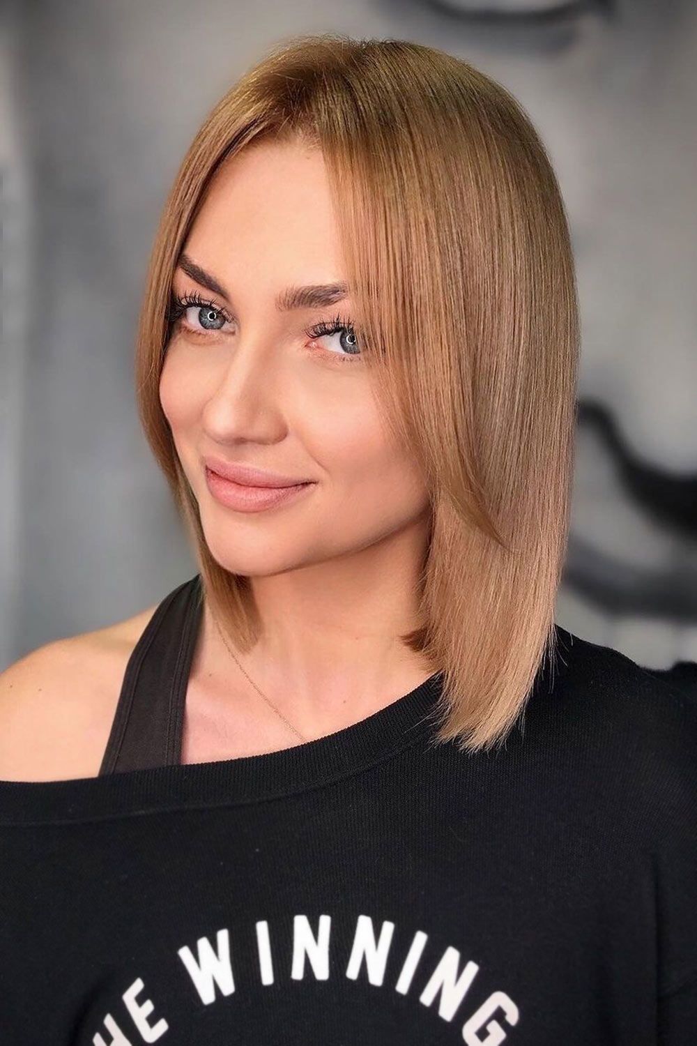 Medium Haircut With Curtain Bangs