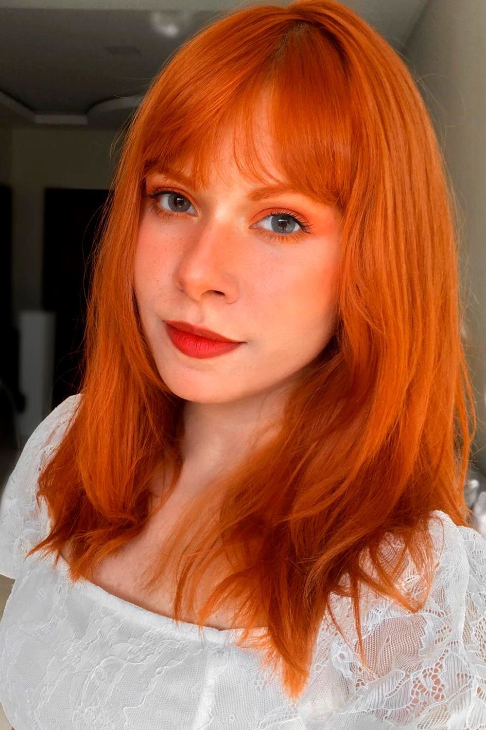 Red Medium Hair With Curtain Bangs