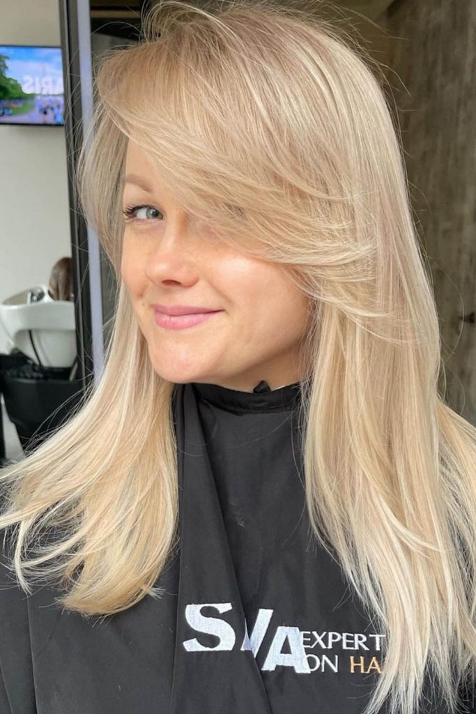 Medium Layered Hair with Side Bang and Highlights